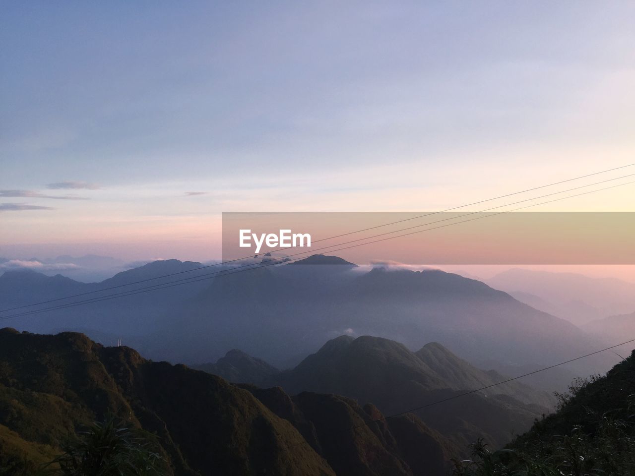 Scenic view of mountains against sky during sunset