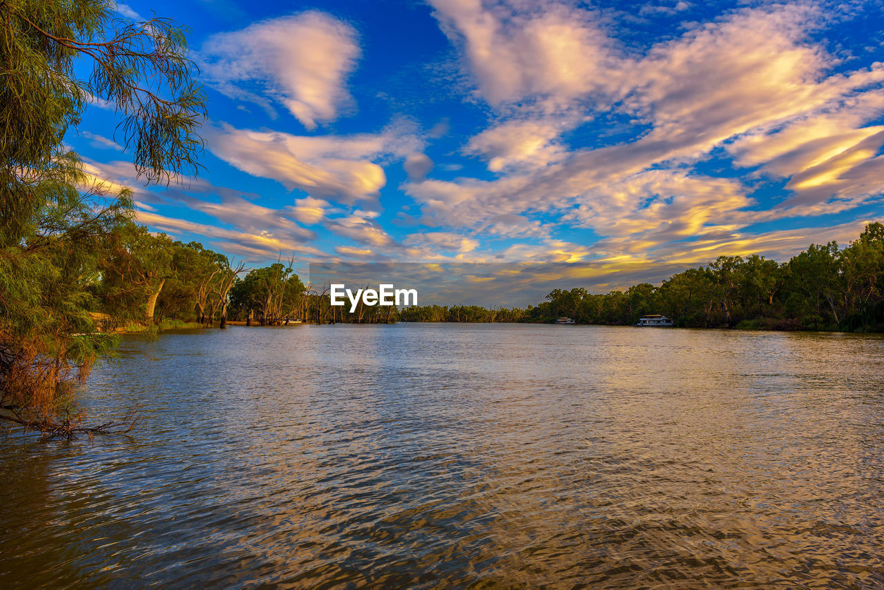 scenic view of lake against cloudy sky