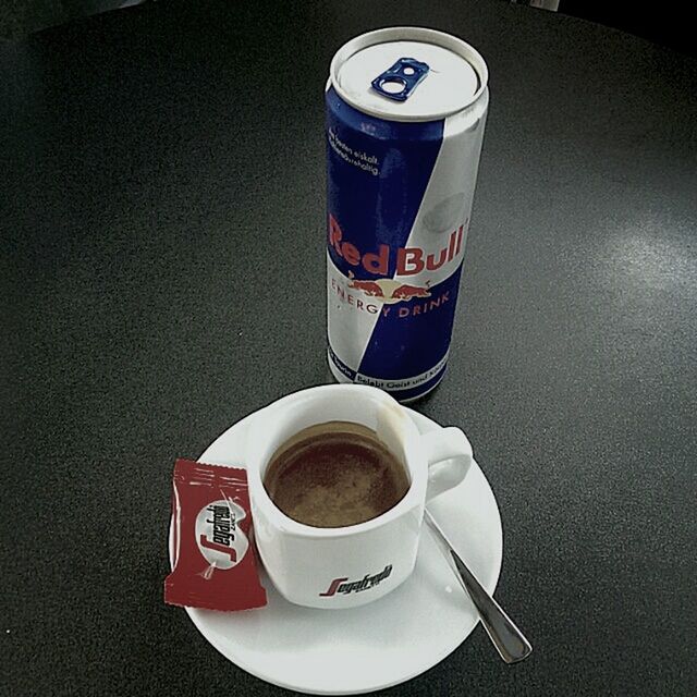 CLOSE-UP OF COFFEE CUP WITH COFFEE CUP