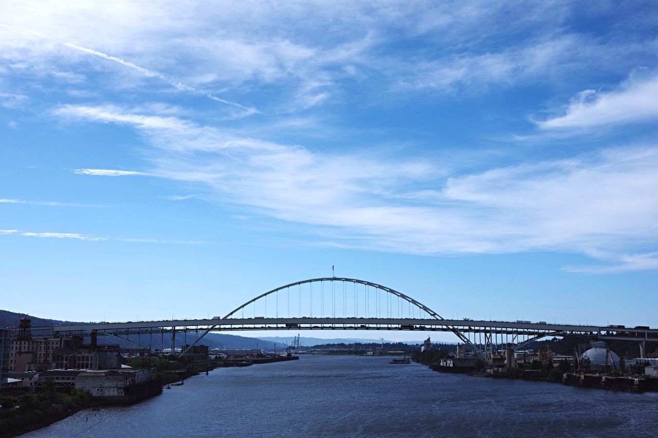 Scenic view of fremont bridge over river against sky