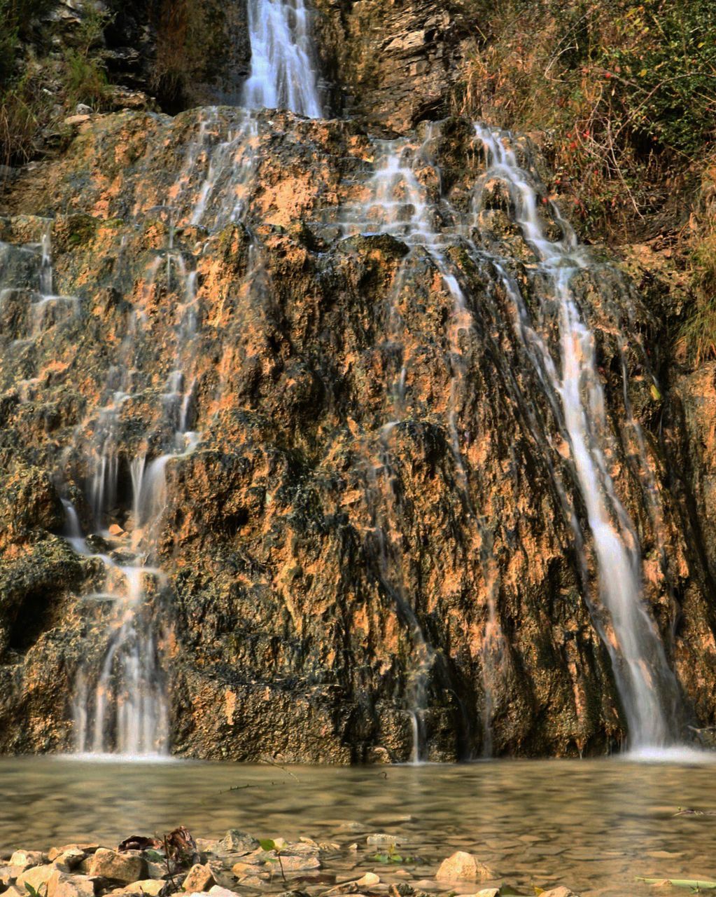 VIEW OF WATERFALL ALONG LANDSCAPE