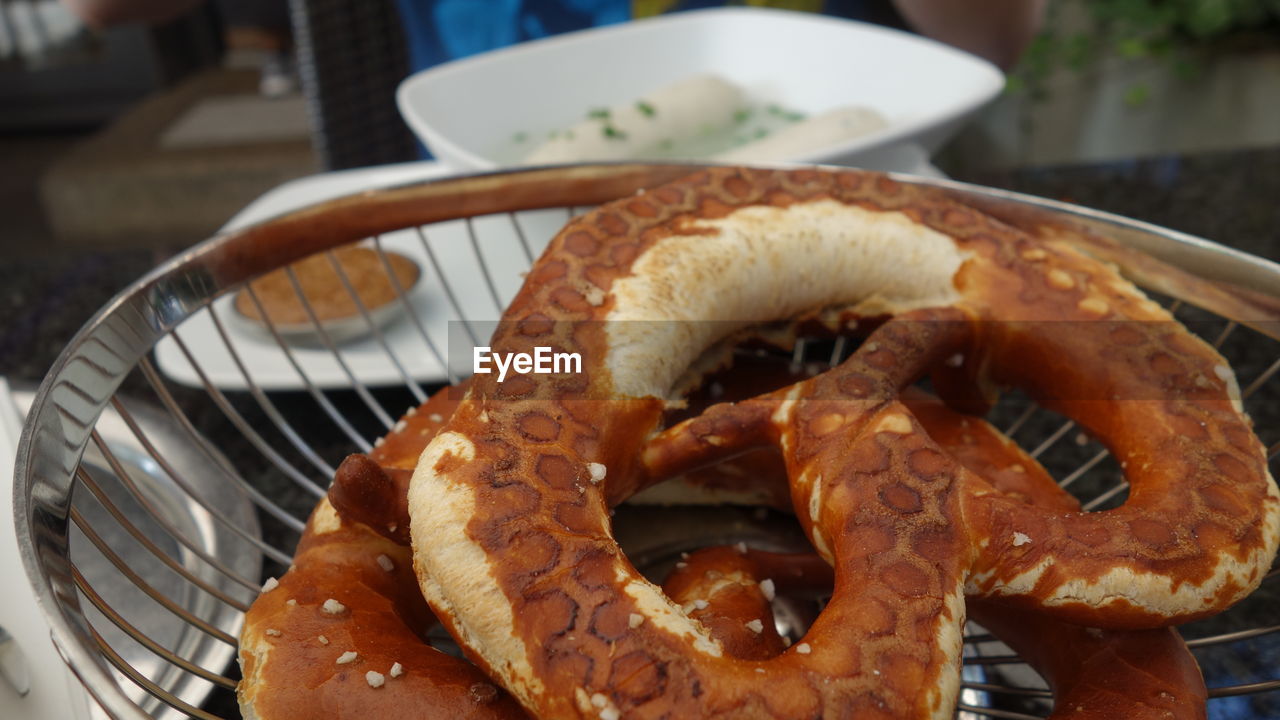 CLOSE-UP OF BURGER ON TABLE