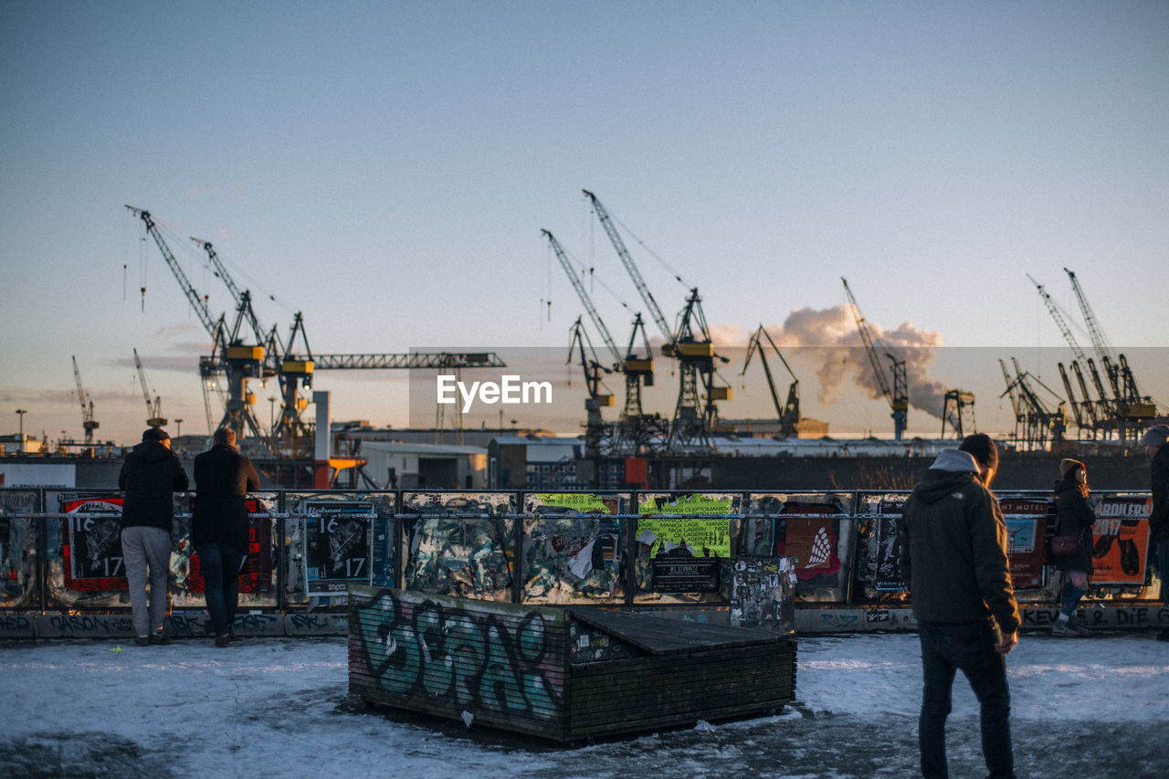 CONSTRUCTION SITE AT HARBOR AGAINST CLEAR SKY