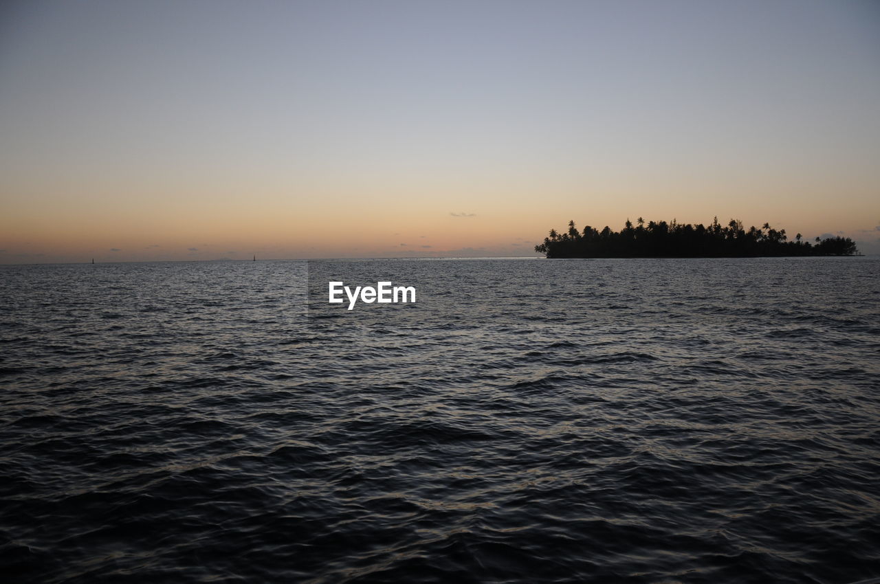 Scenic view of sea at dusk