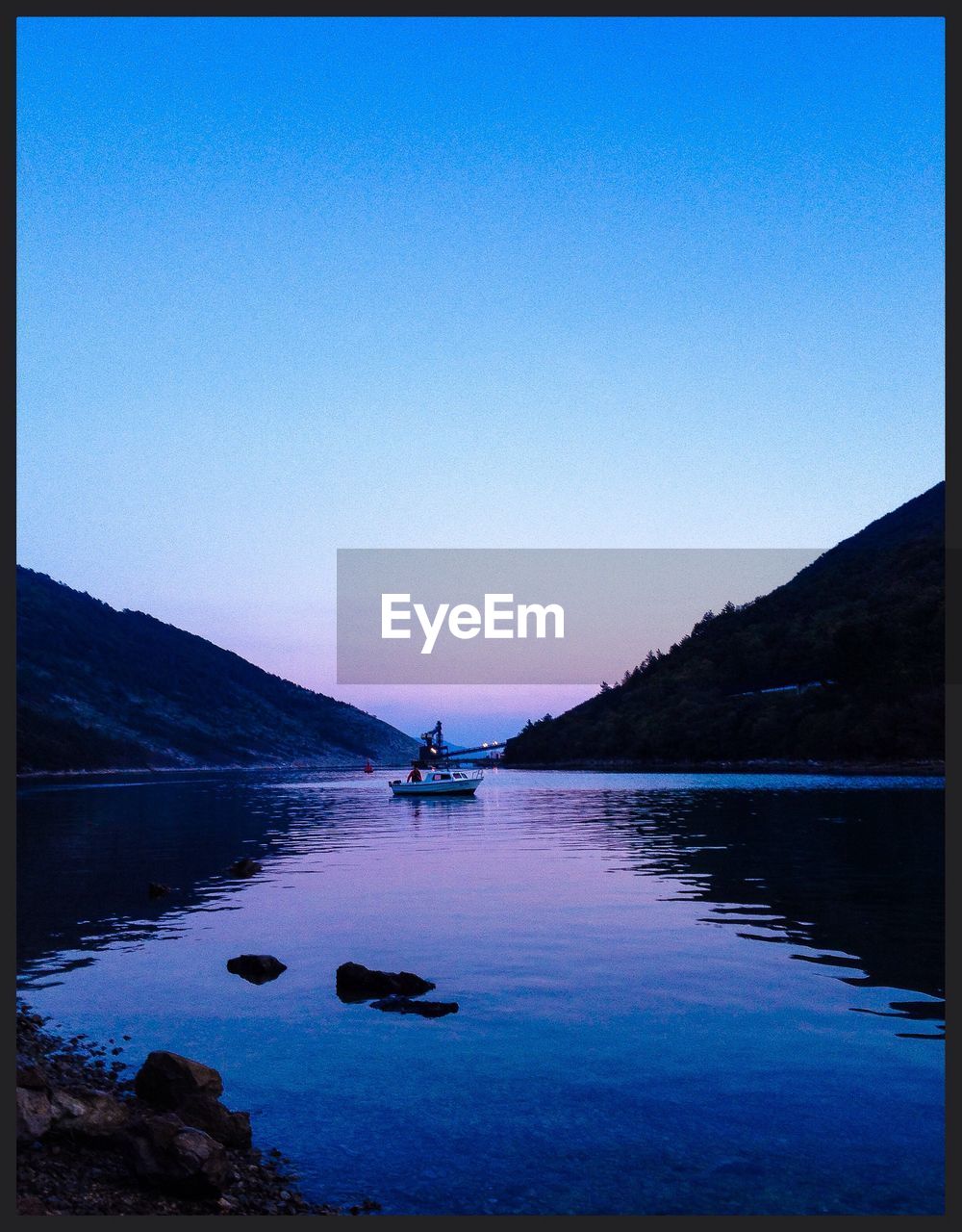 SCENIC VIEW OF CALM SEA AGAINST CLEAR SKY