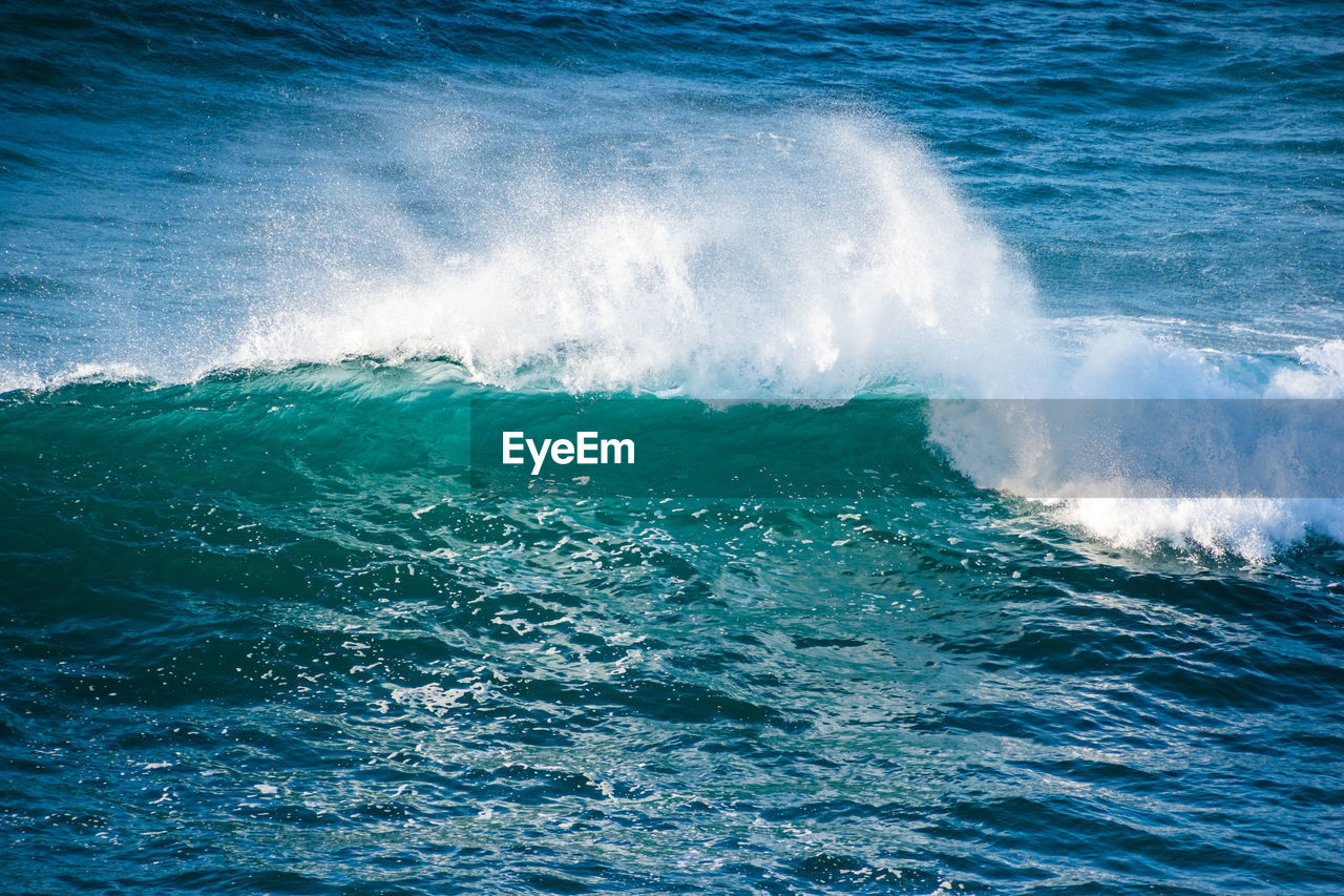 SEA WAVES SPLASHING ON SHORE