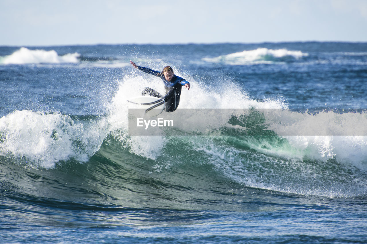 Surfer exploring the coast of ireland on a surf trip