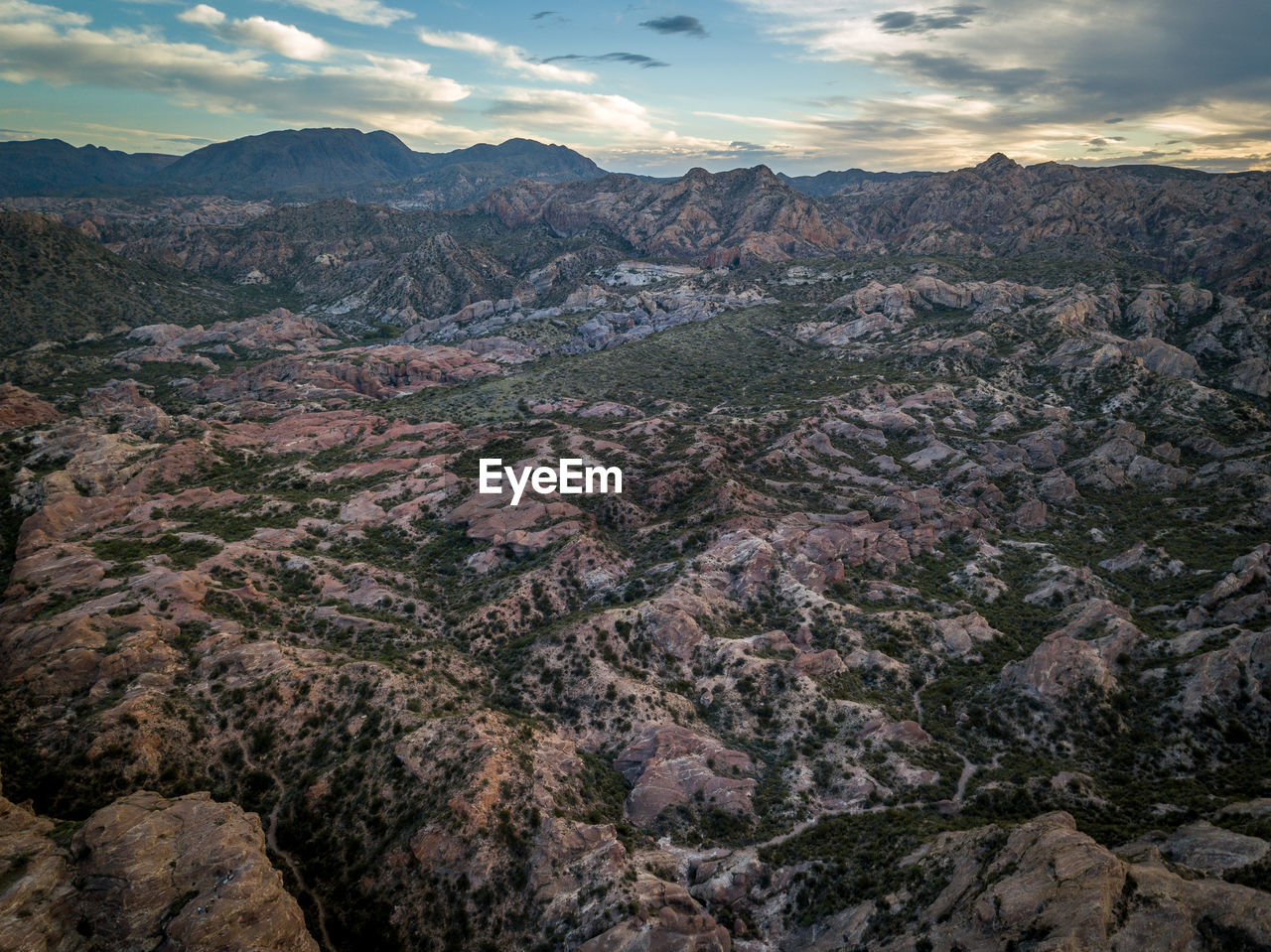 Aerial view of landscape against cloudy sky