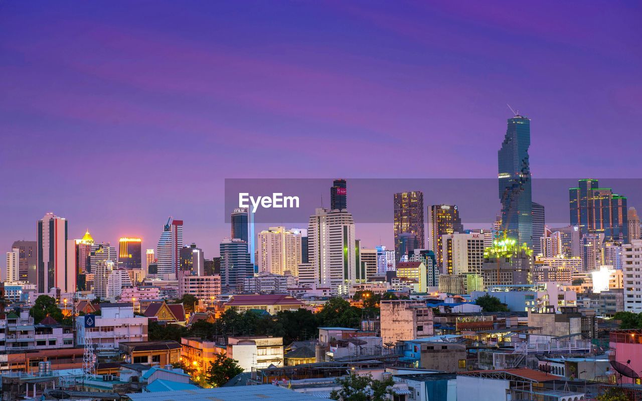 Illuminated cityscape at dusk