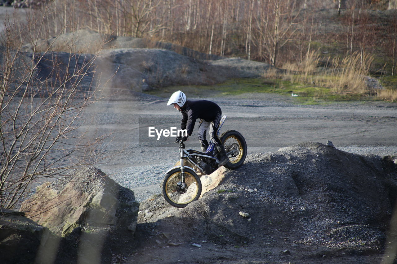 MAN RIDING HORSE WITH MOTORCYCLE