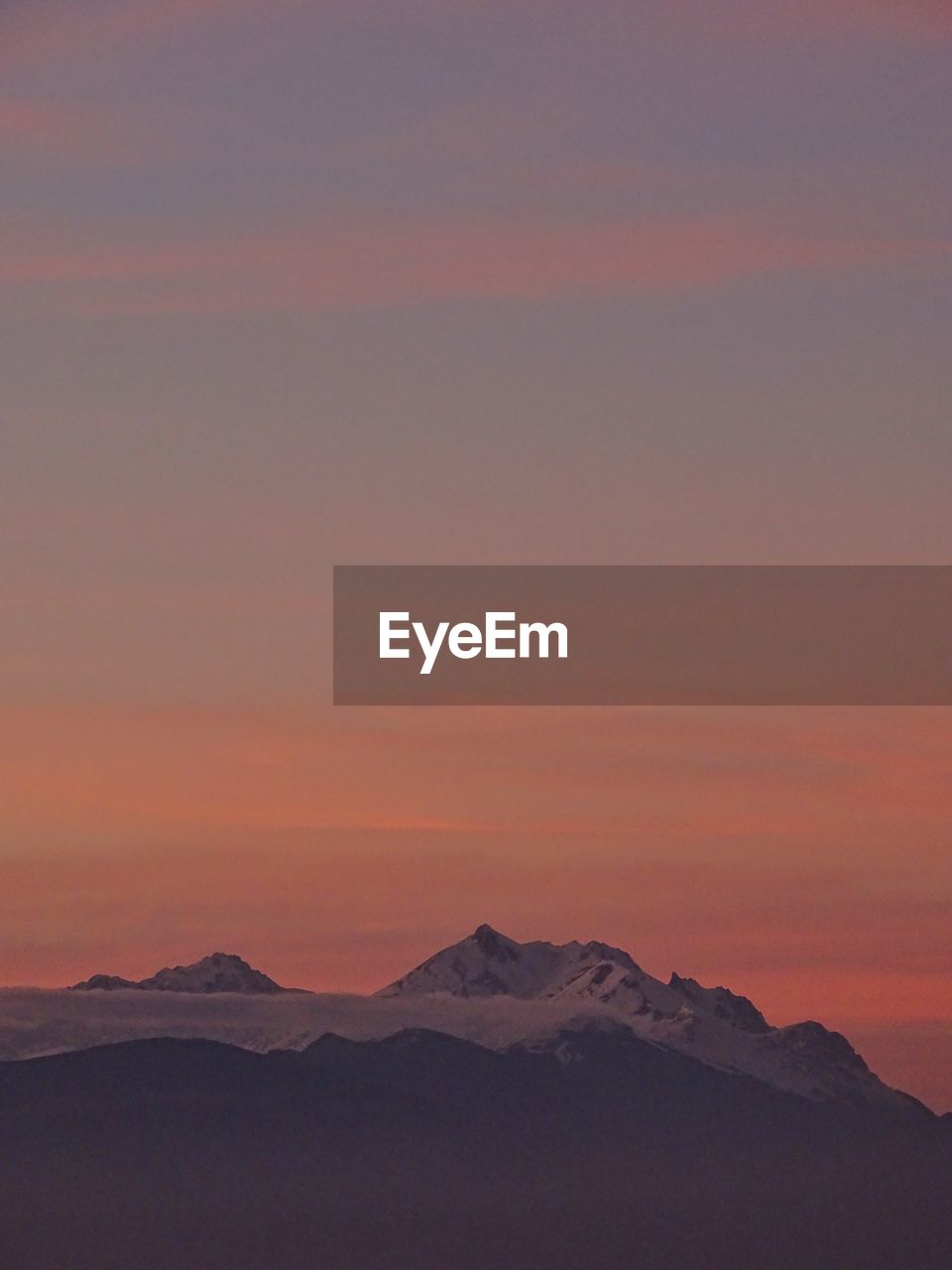 Scenic view of mountains against sky during sunset