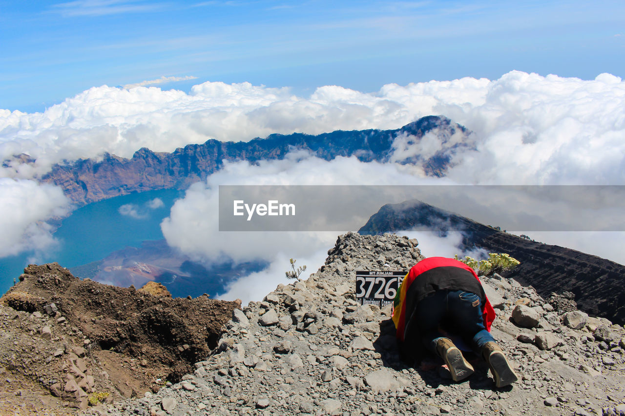 Man on mountain against sky