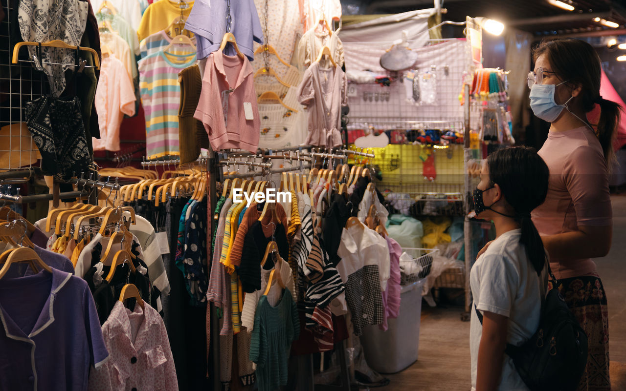 Mother and daughter shopping at market