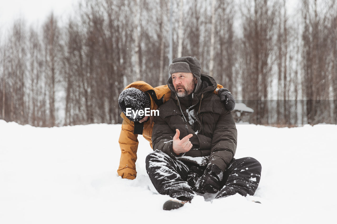 Man skiing on snow covered landscape