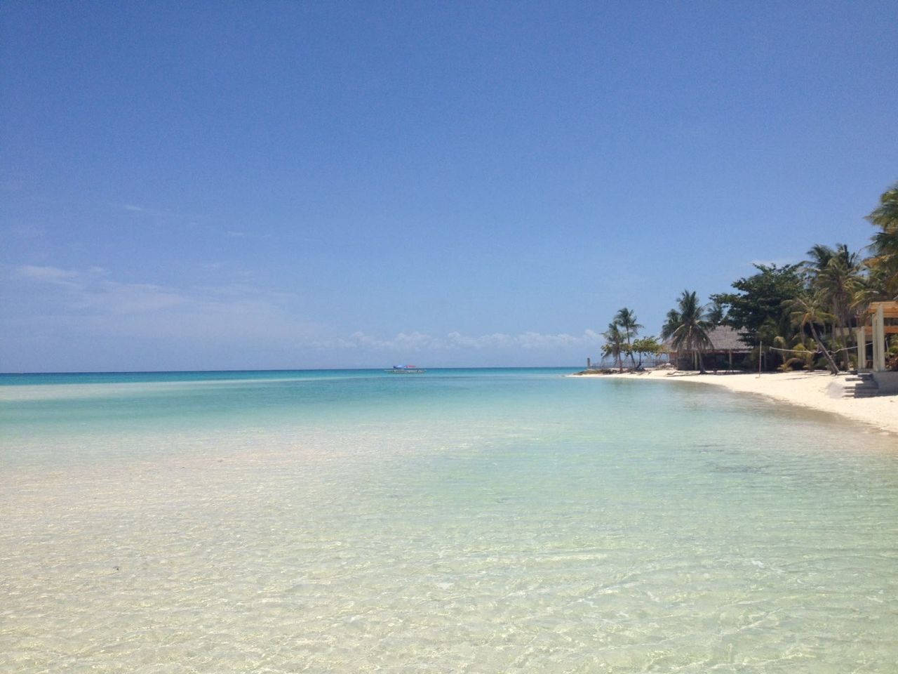 Scenic view of calm sea against clear sky