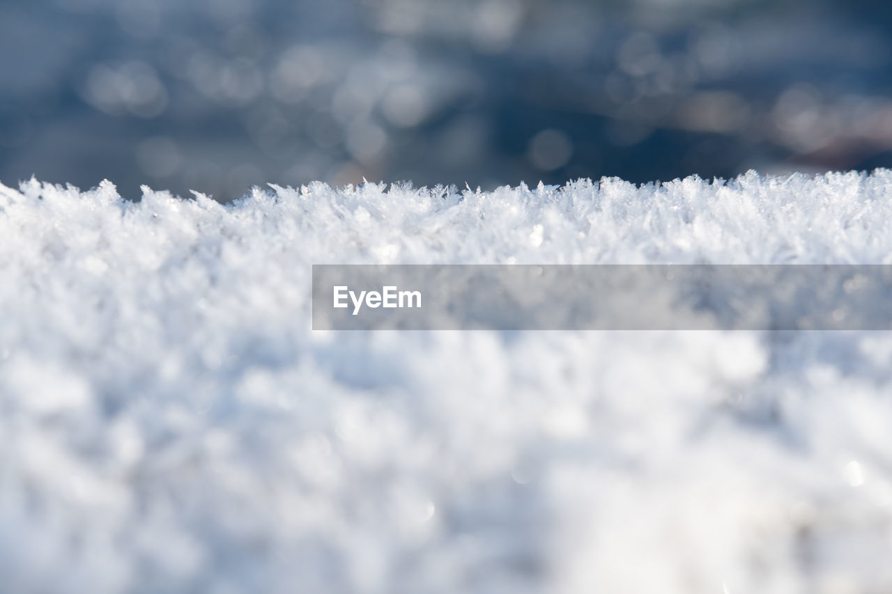 freezing, snow, winter, cold temperature, frost, nature, white, frozen, cloud, no people, selective focus, sky, snowflake, ice, beauty in nature, environment, close-up, backgrounds, day, outdoors, freshness, macro photography, sunlight