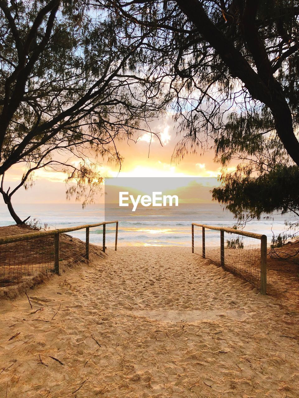 Scenic view of beach and sea against sky during sunset