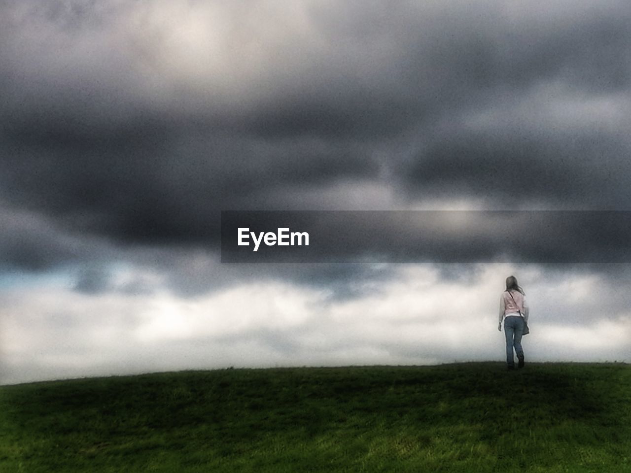 WOMAN STANDING ON FIELD