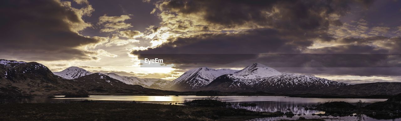 Scenic view of snowcapped mountains against sky during winter