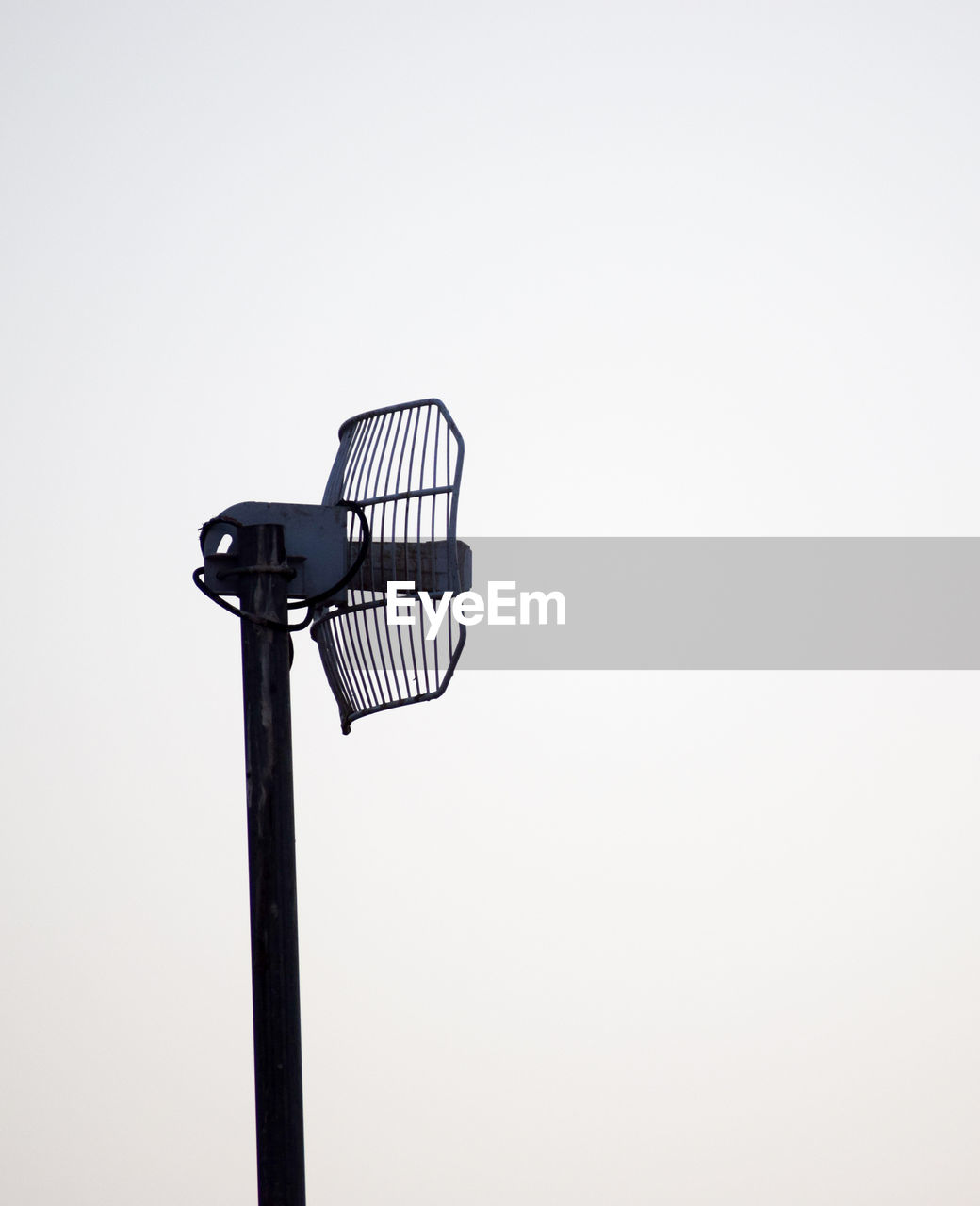 Low angle view of antenna against clear sky