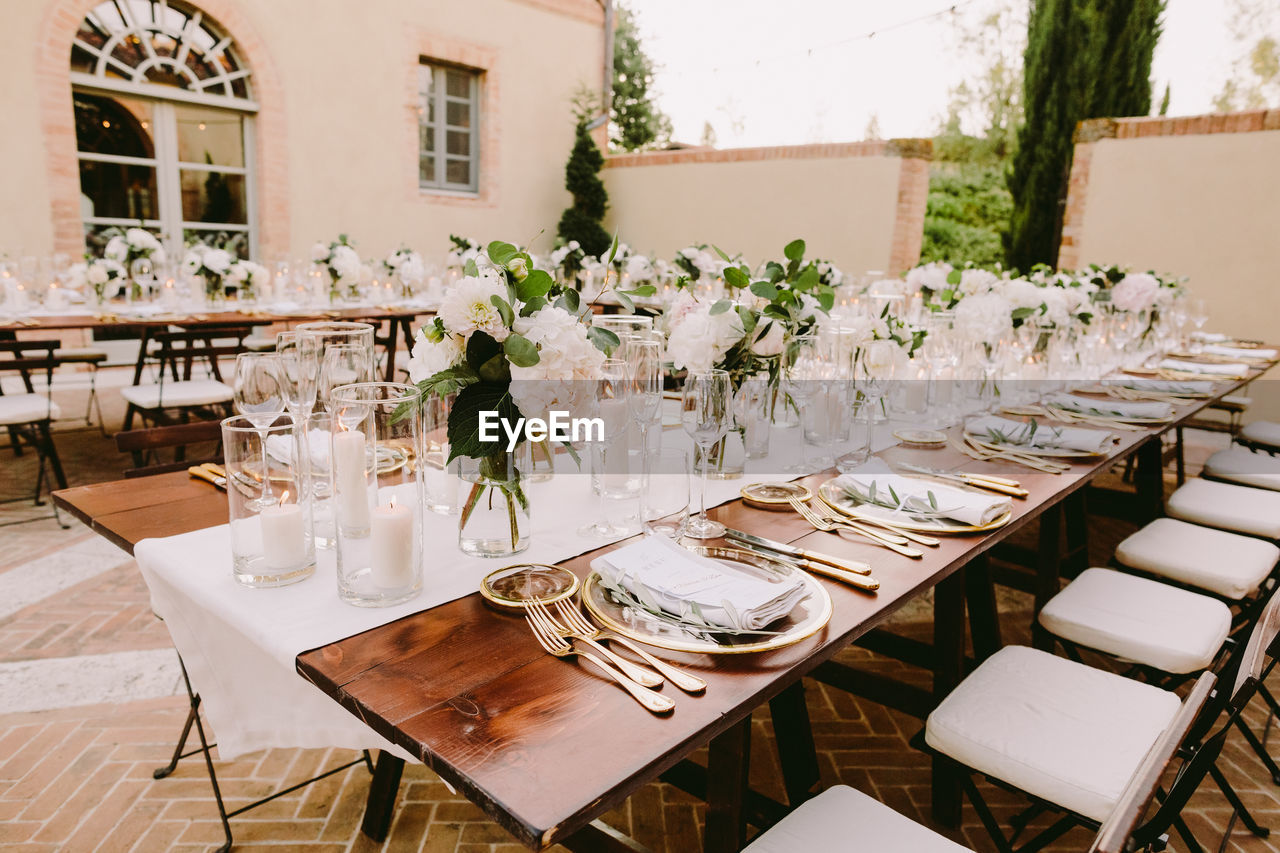 EMPTY CHAIRS AND TABLES IN RESTAURANT