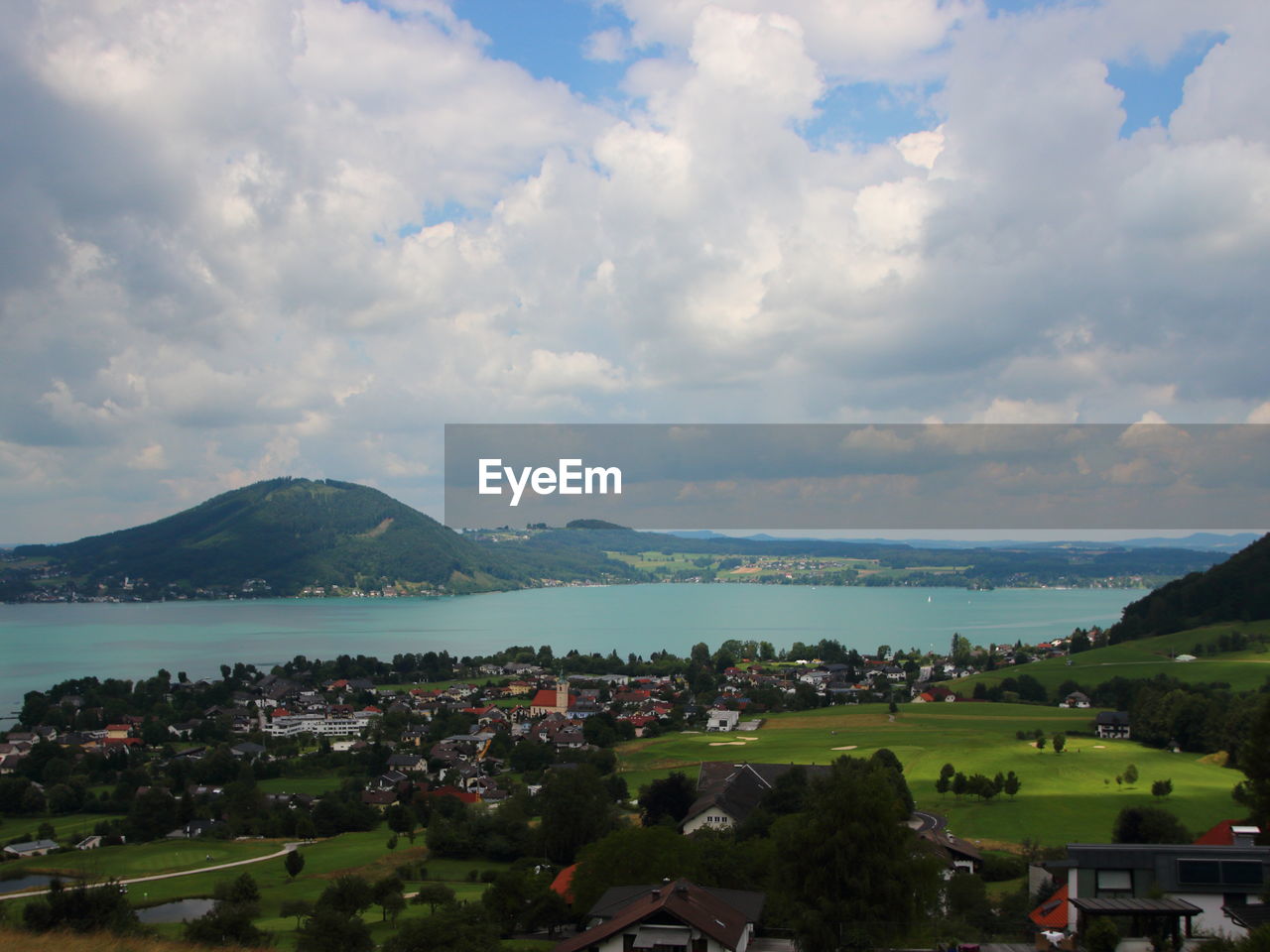 TOWN BY SEA AND MOUNTAINS AGAINST SKY