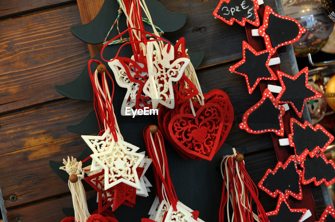 Close-up of christmas decorations hanging at market stall