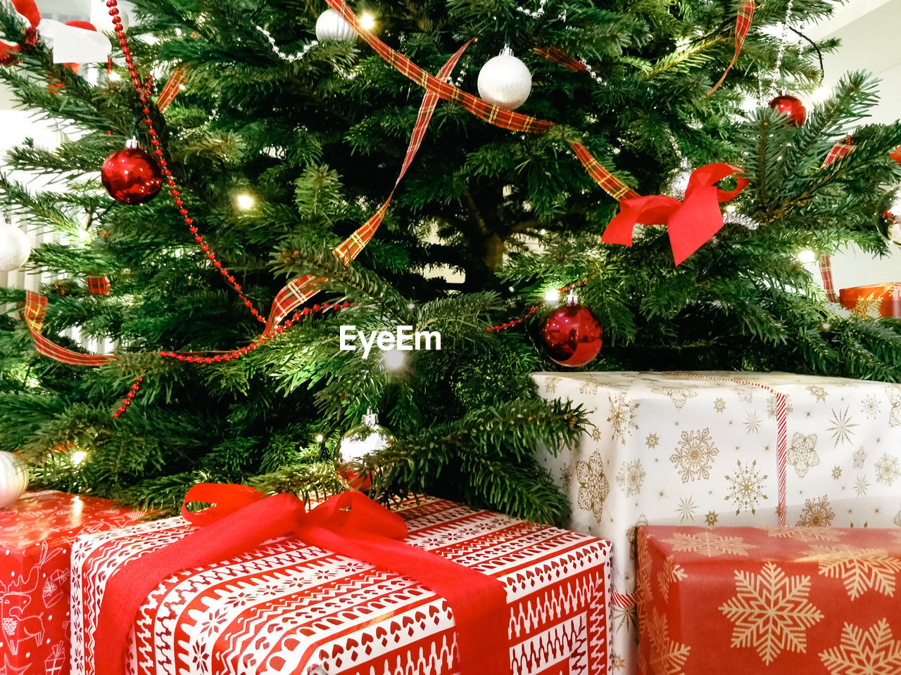 Christmas presents and decoration hanging on christmas tree