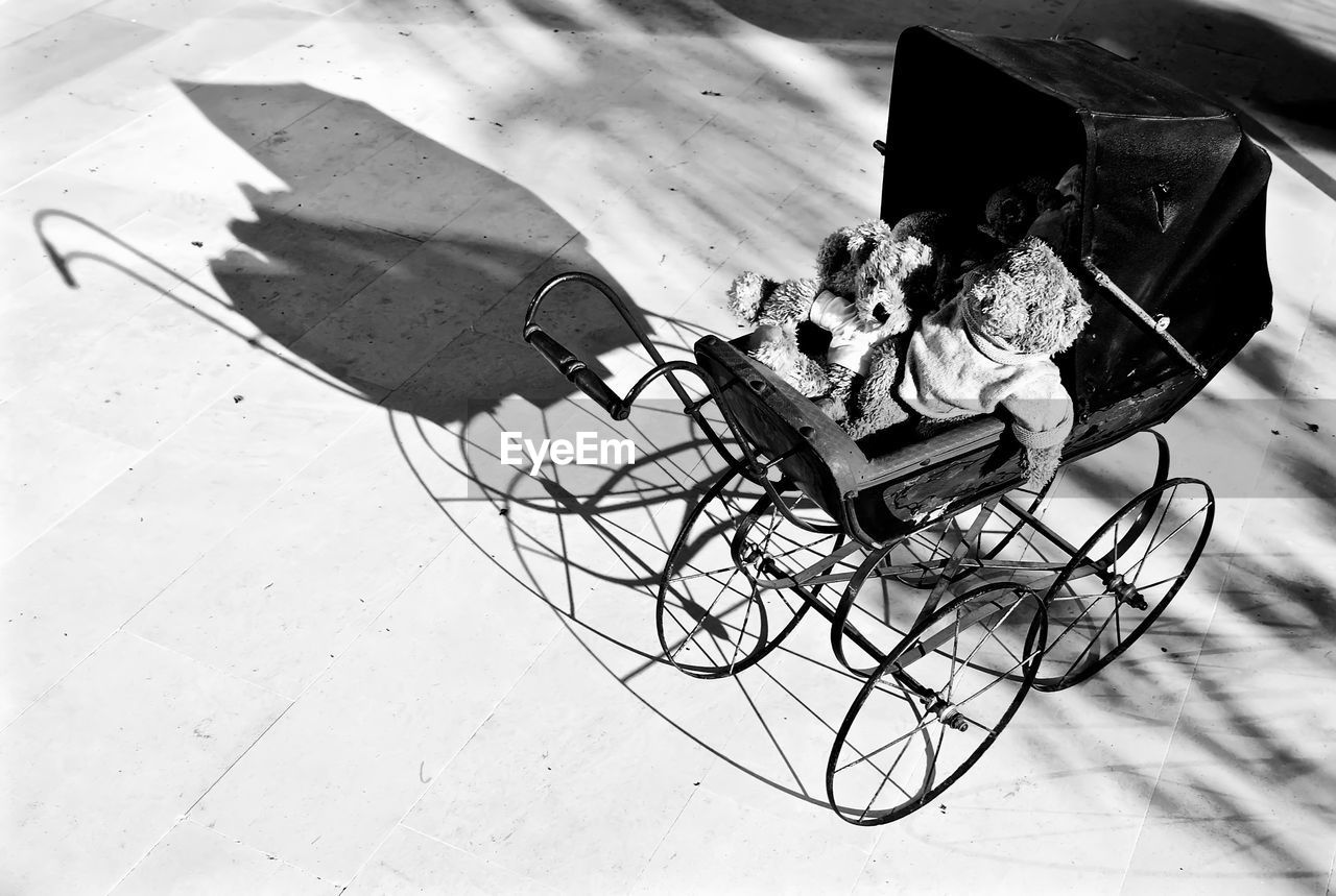 High angle view of baby carriage with toys