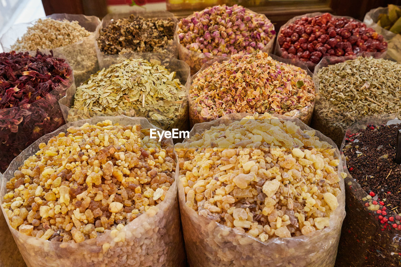 Large sacks of dried spices, tea and incense at bazaar market in dubai, filling the frame