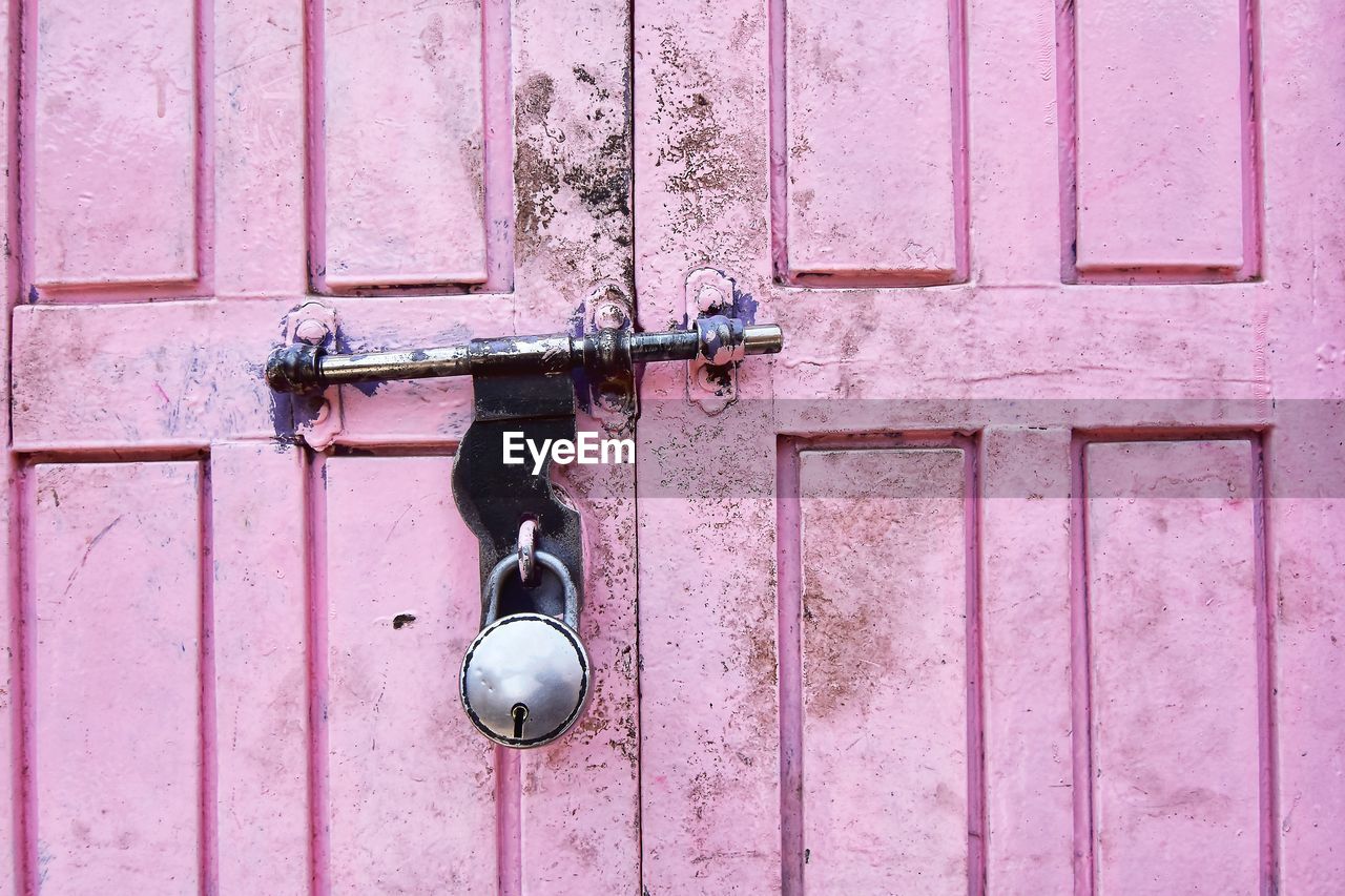 Close-up of closed pink door