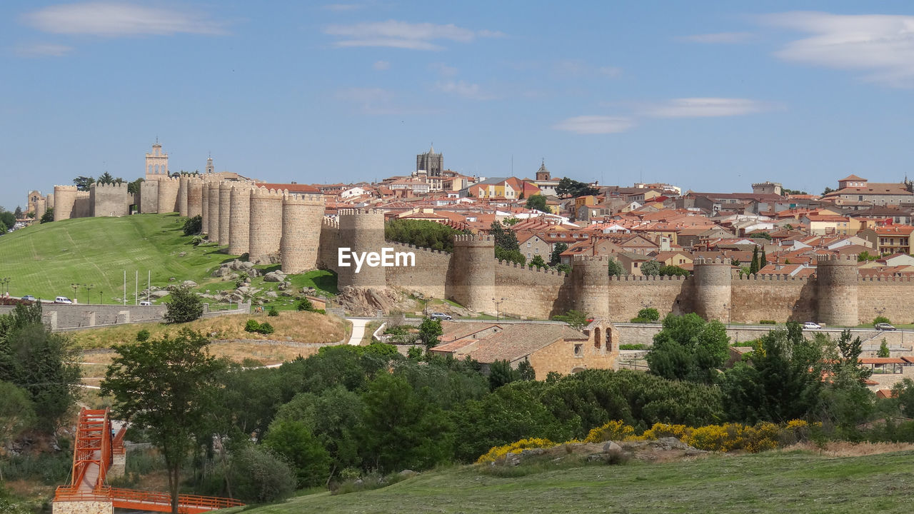 Buildings in city against sky