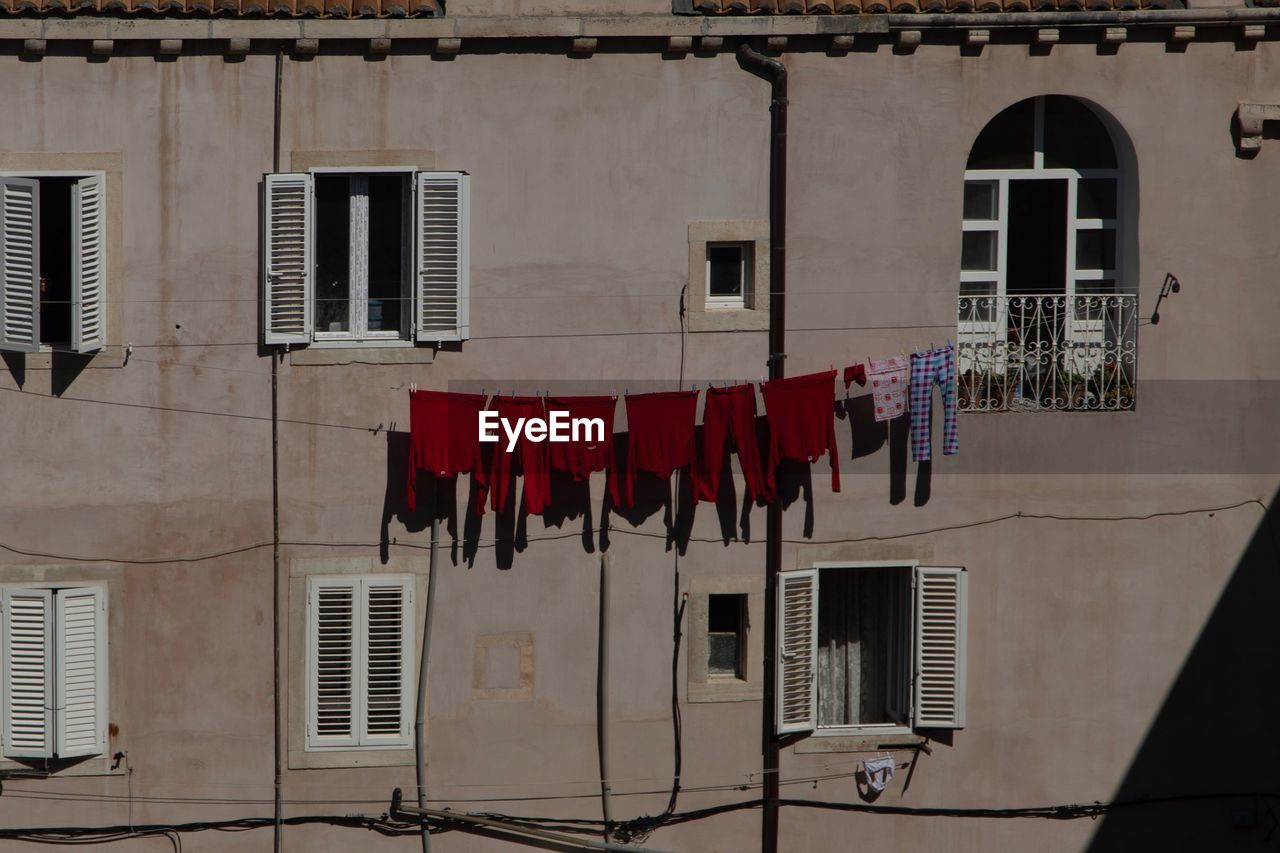 CLOTHES DRYING ON BUILDING