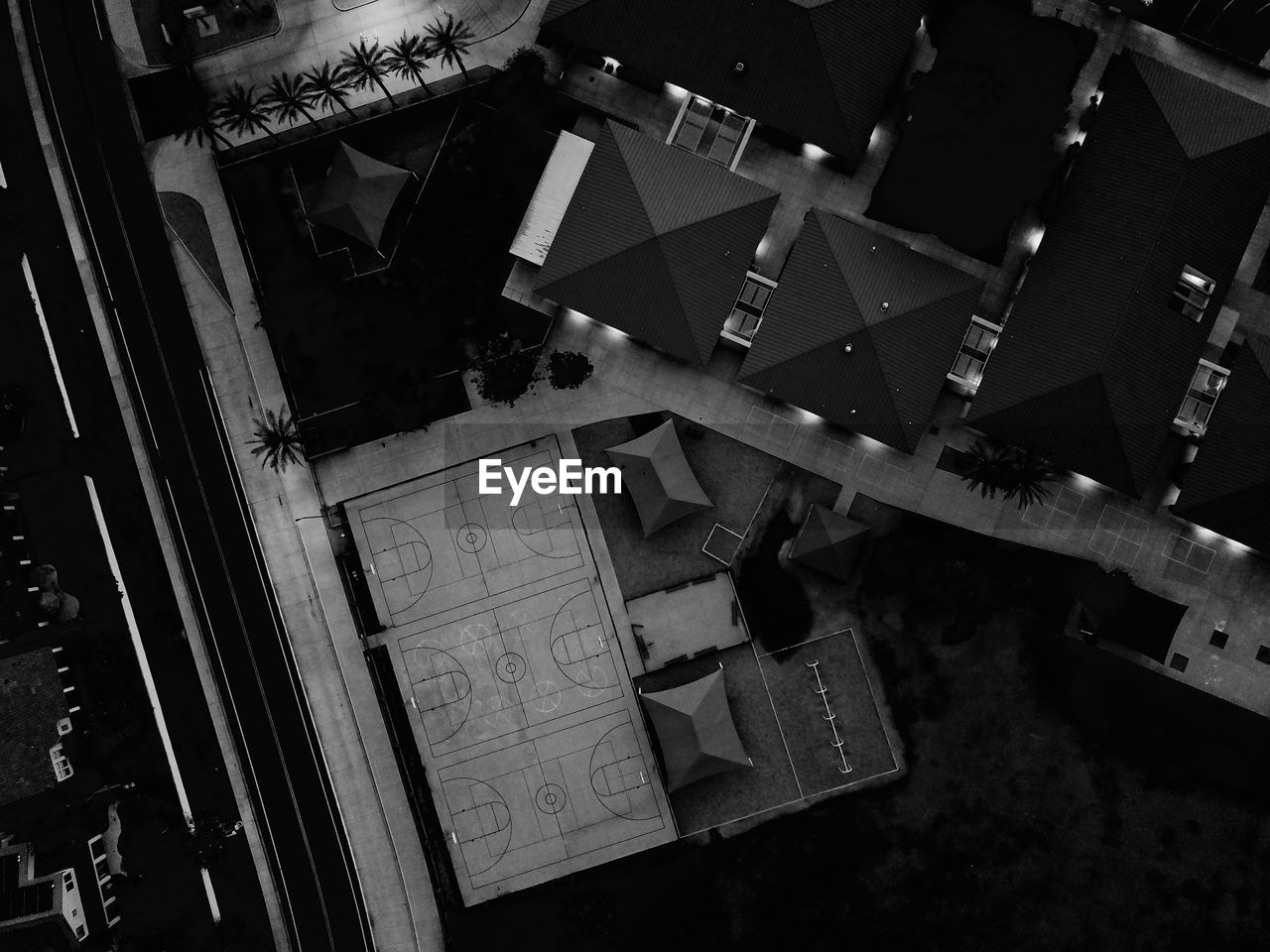 High angle view of school yard at night in black and white.