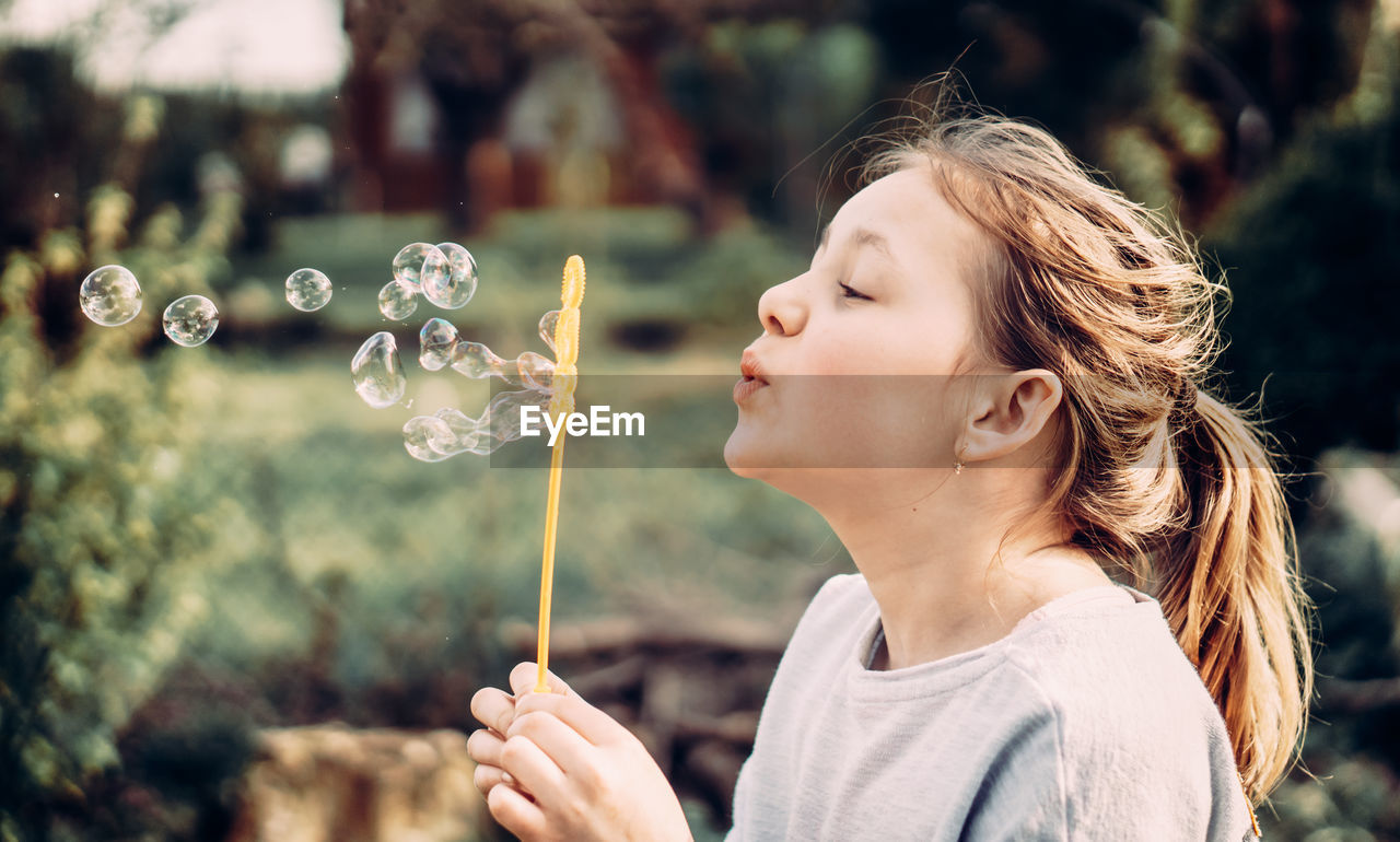 Girl looking at bubbles