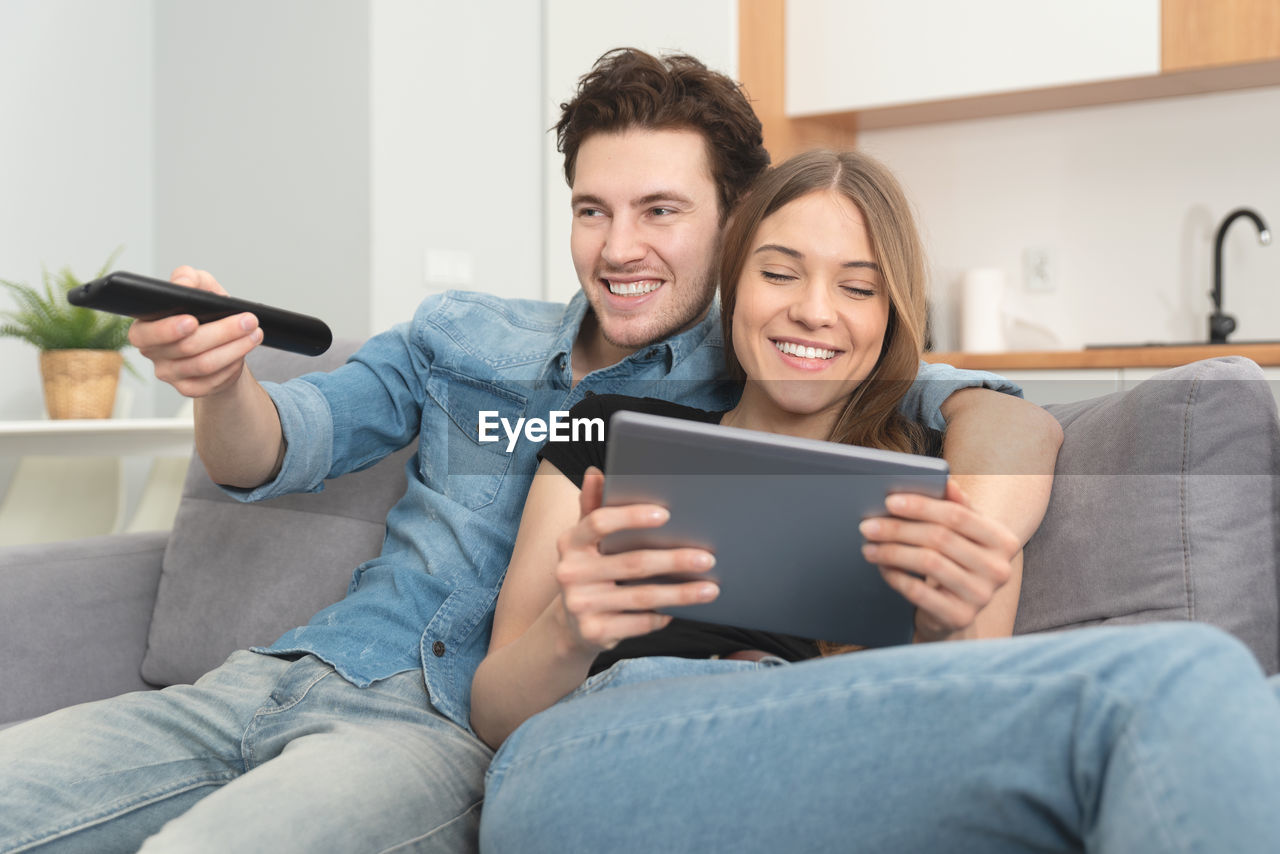 Young couple watching tv