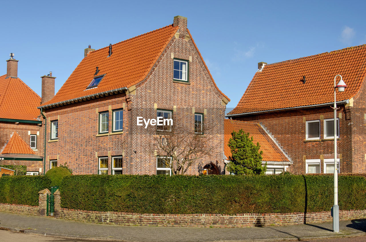 House-shaped housing development with traditional brick architecture from the 1930's