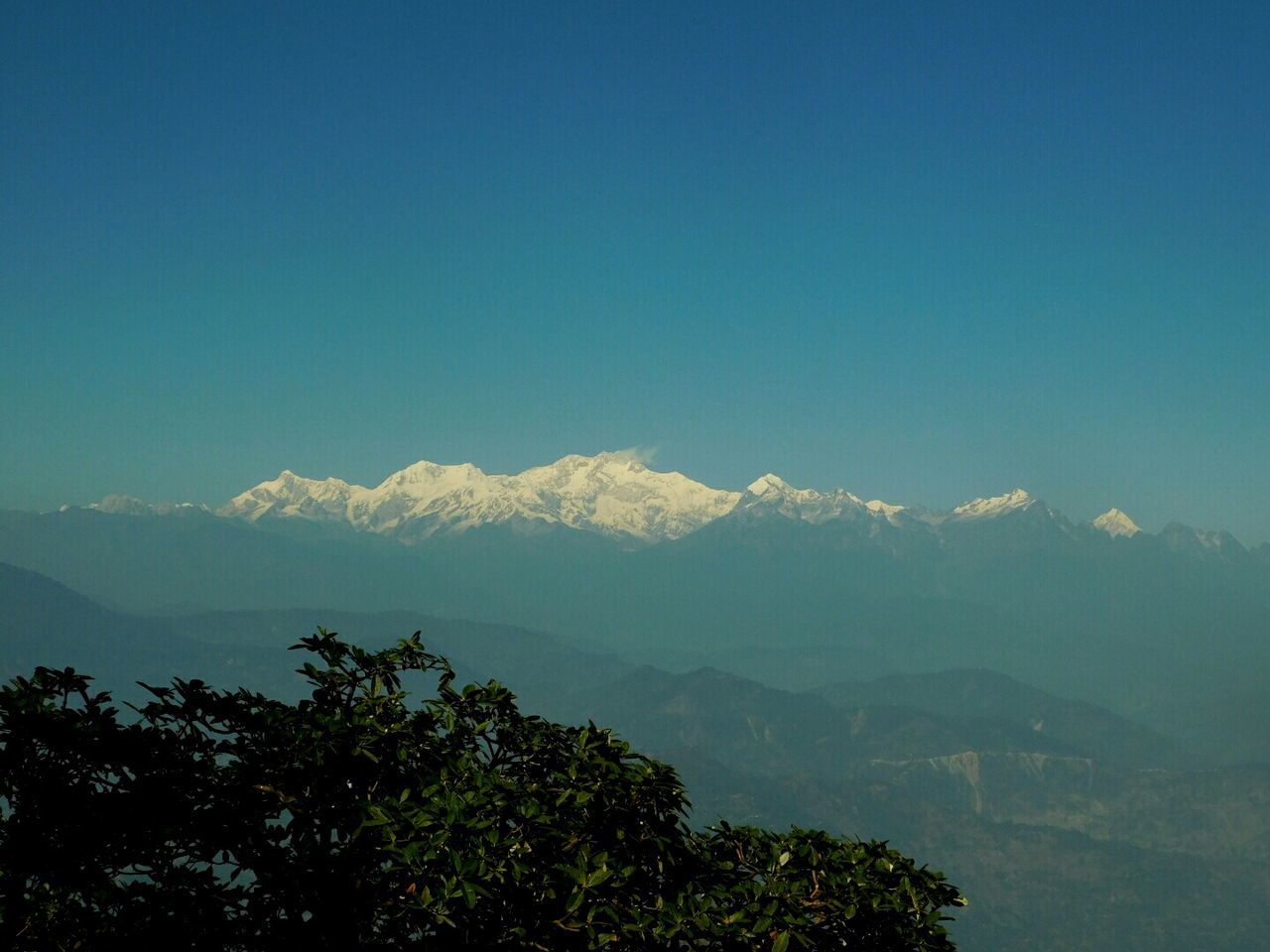 SCENIC VIEW OF MOUNTAINS AGAINST BLUE SKY