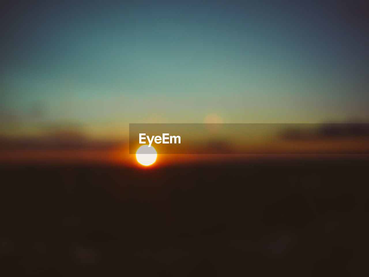 DEFOCUSED IMAGE OF SUNSET