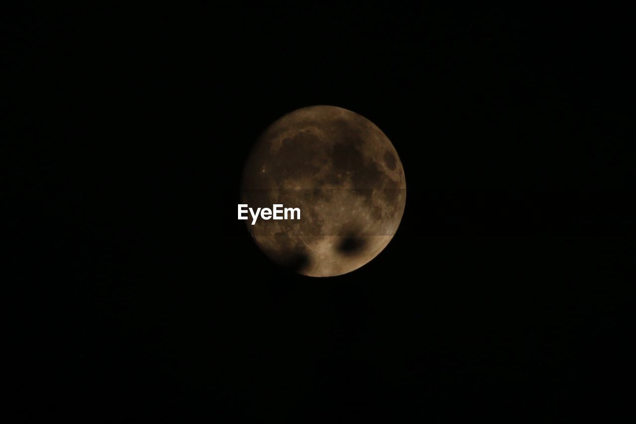 LOW ANGLE VIEW OF MOON AT NIGHT