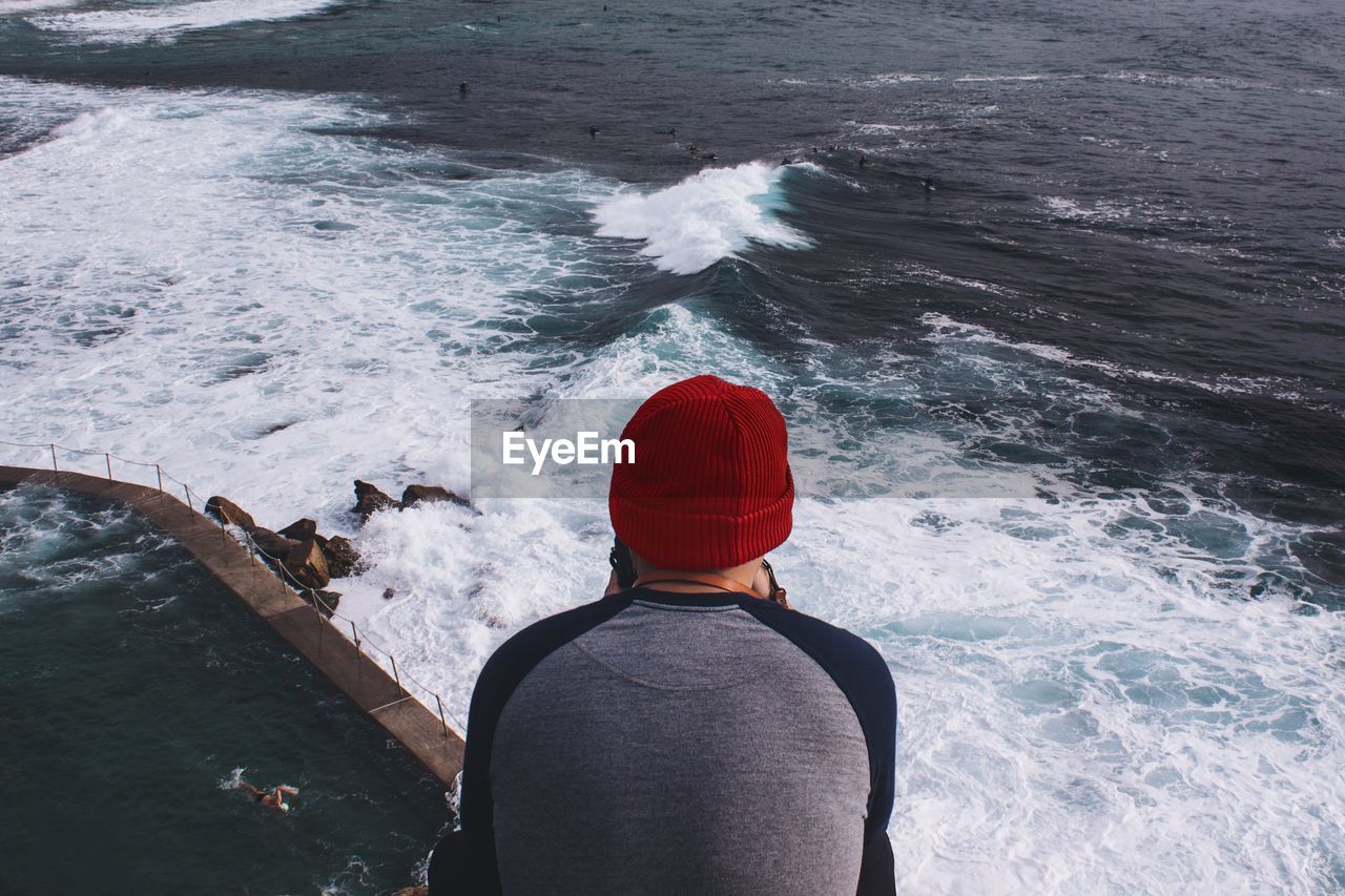 Rear view of man looking at sea view