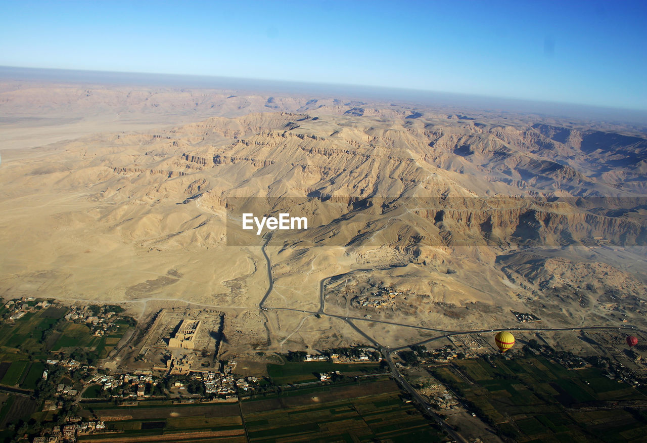 High angle view of field against clear sky