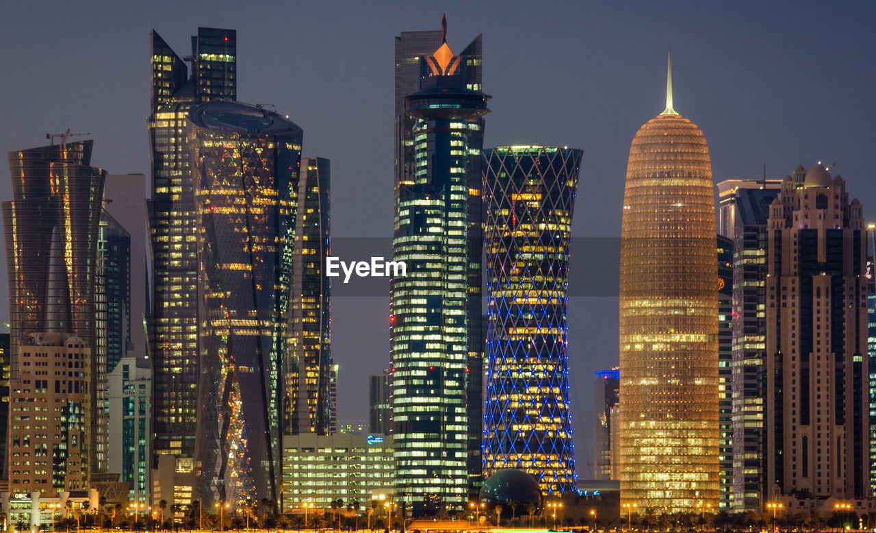 Illuminated buildings in city at night