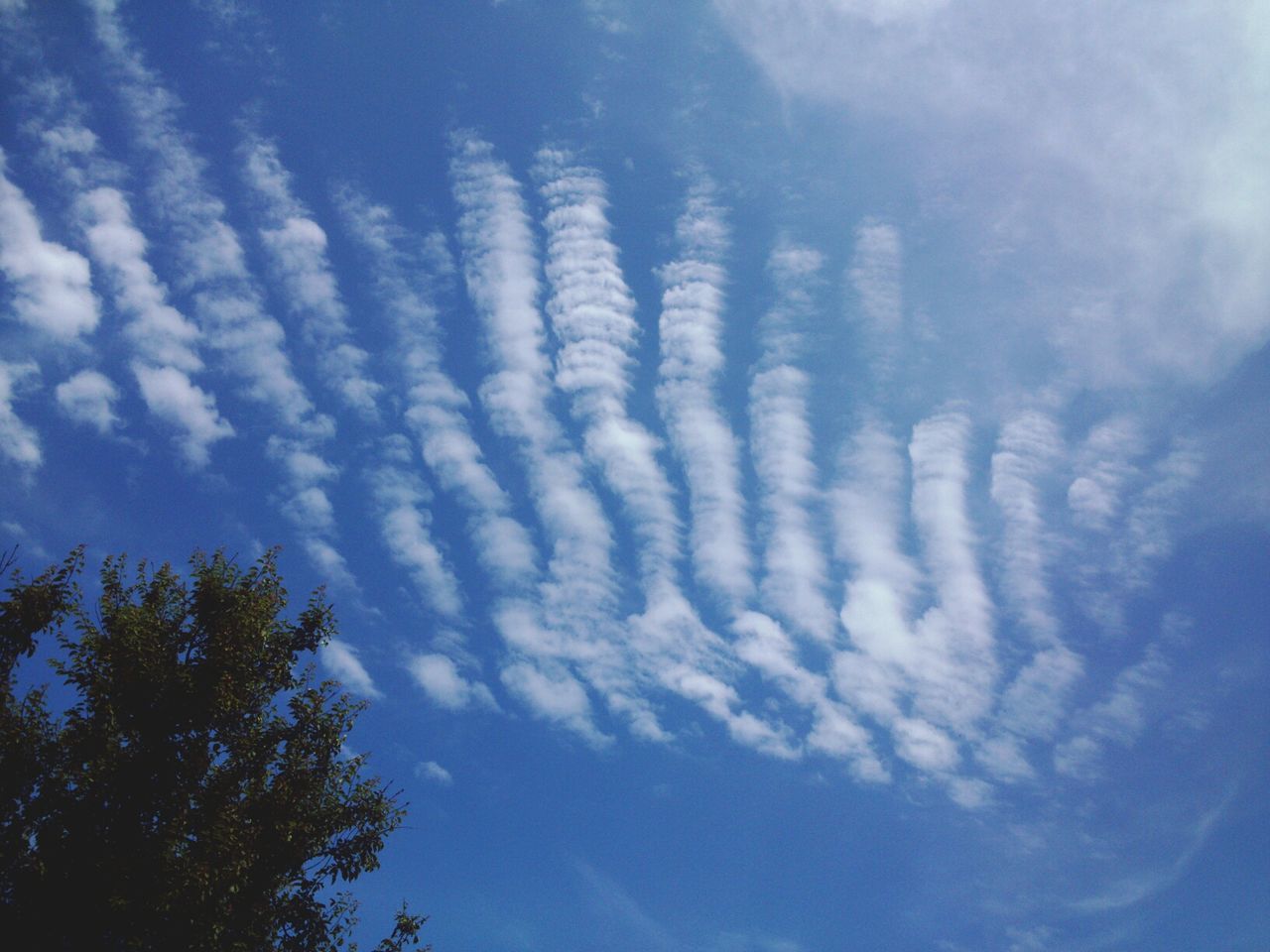 Low angle view of clouds in sky during sunny day