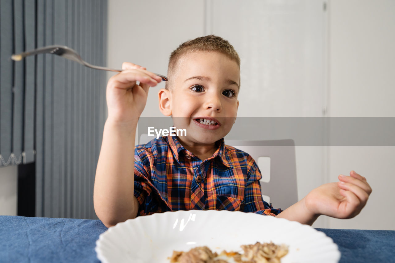 Close-up of boy eating food