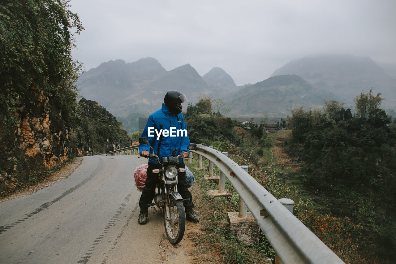 Man riding motorcycle on the mountain road