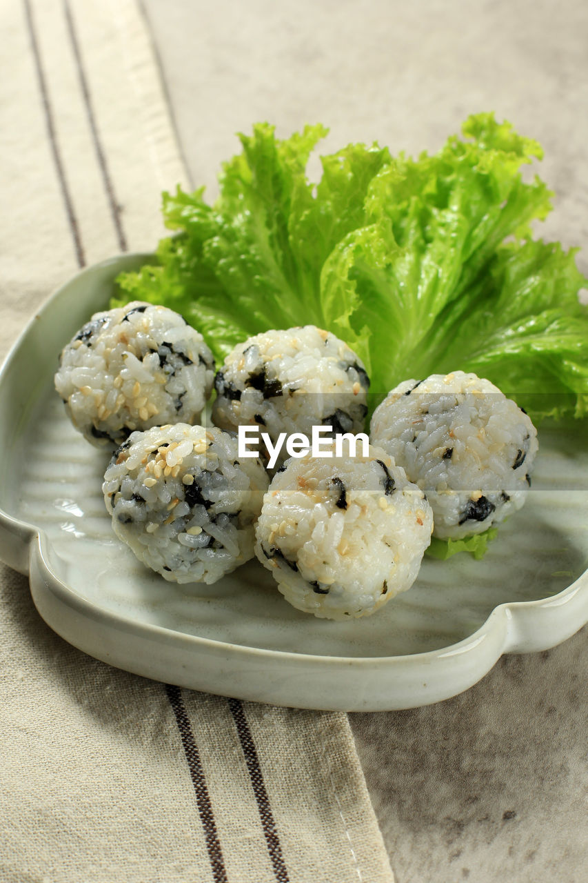 Korean seaweed rice balls or jumeokbap with sesame seed, sesame oil, and vegetable