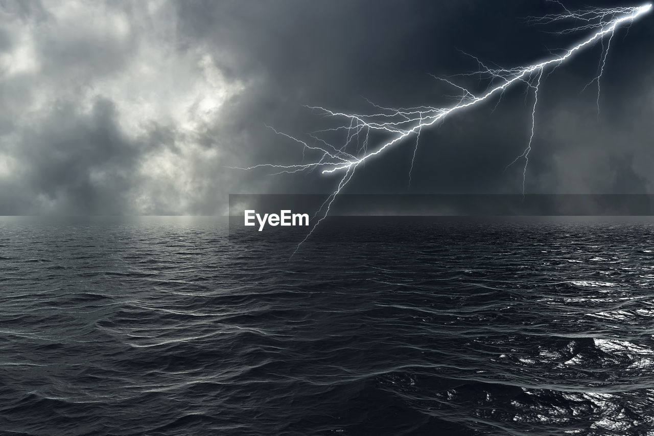 LIGHTNING OVER SEA AGAINST STORM CLOUDS