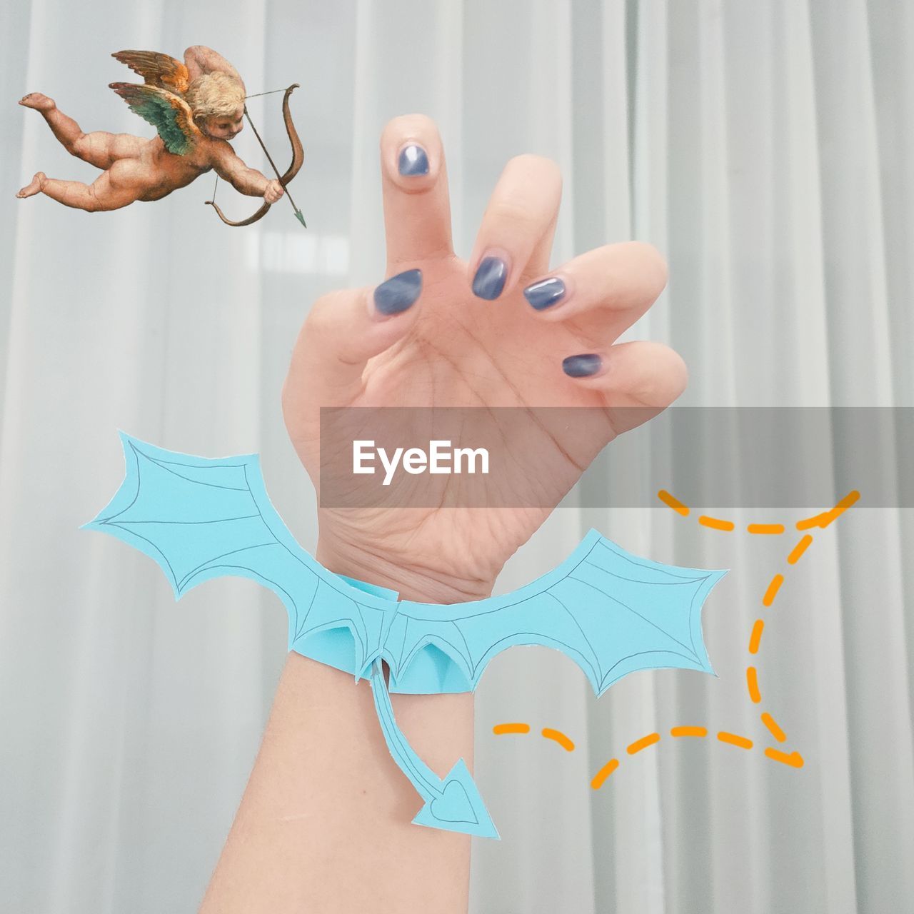 DIGITAL COMPOSITE IMAGE OF HAND WITH BUTTERFLY ON FINGER