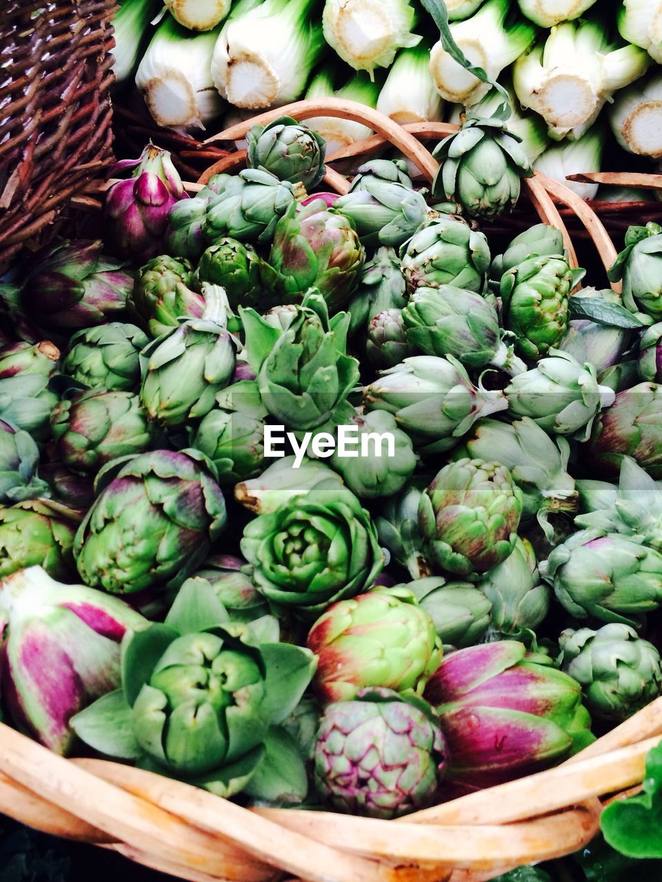 High angle view of artichokes for sale at market stall